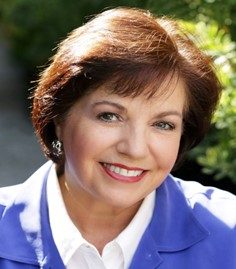 A picture of Kathy Poff smiling on a sunny day